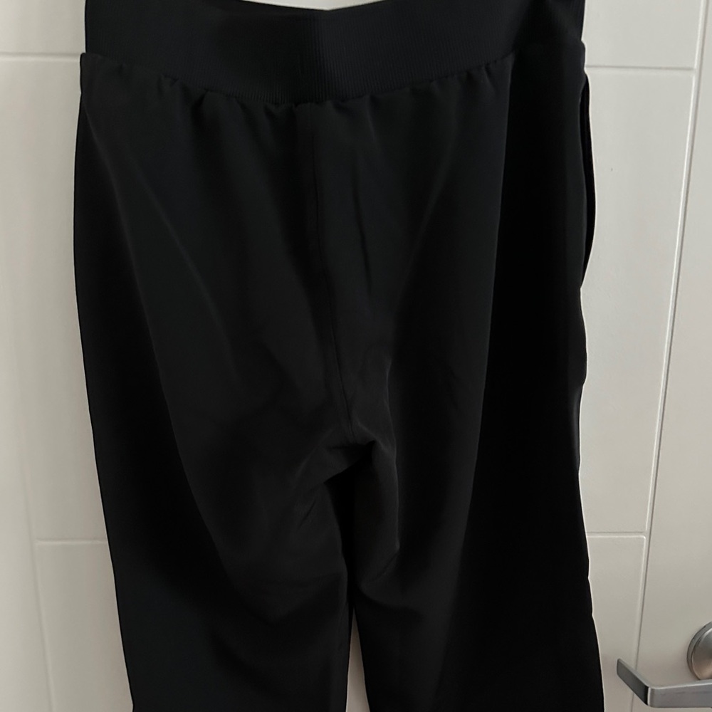 Black Bermuda shorts.